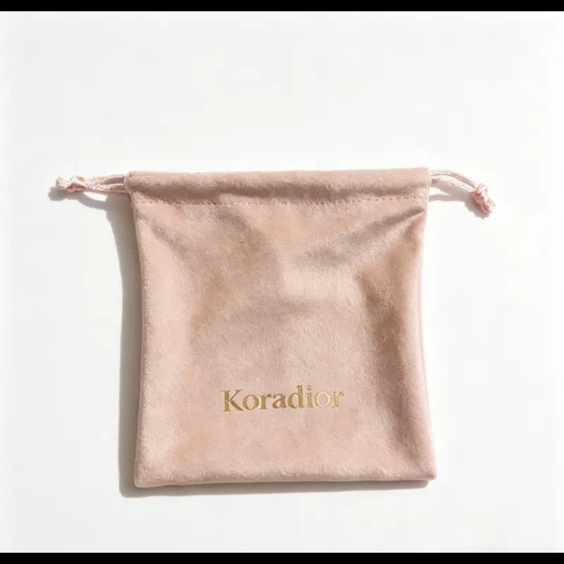 Velvet pouch with gold drawstring cord