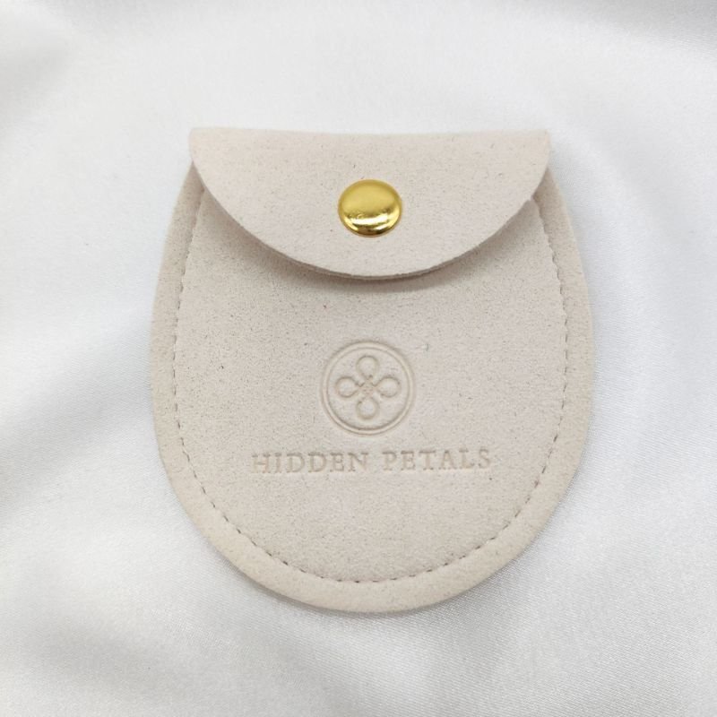 Velvet pouch with embroidered gold logo
